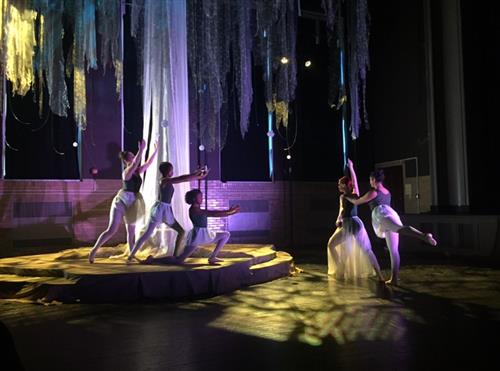 Ballet dancers on stage dancing. 